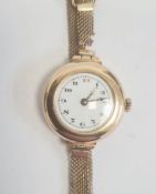 Vintage lady's 9ct gold wristwatch with enamel dial, on rolled gold mesh strap