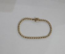 9ct gold and diamond tennis bracelet, each small diamond illusion set, approx. 0.5ct