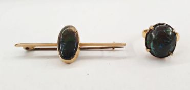 Australian gold bar brooch by Stevenson, set with an opal cabochon, marked 'Stevenson 15ct', 5.5cm