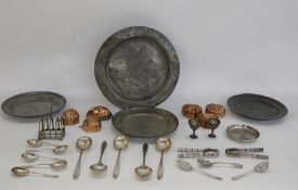 Six copper jelly moulds, three pewter plates and assorted EPNS flatware