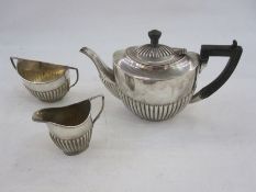 Matched silver half-gadrooned three-piece tea service, varying dates and makers, gross weight 17.5oz