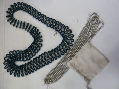 Appartement a Louer teal, plastic and white metal link graduated necklace and strings of simulated