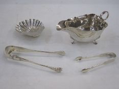 Silver sauceboat with S-scroll handles and on three scroll feet, Birmingham 1948, a silver shell
