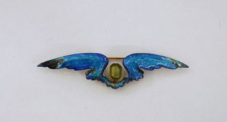 Child & Child white metal, gold and enamel wing brooch set central rectangular peridot with cut-