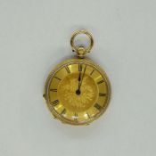 18K gold lady’s open-faced fob watch, the engine-turned dial with floral engraving to centre,
