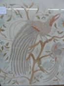 Early 20th century embroidered picture of two peacocks amongst a flowering bush, 55cm x 48cm and a