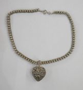 Silver-coloured metal ornate ball chain with ornate silver-coloured metal locket and a silver-