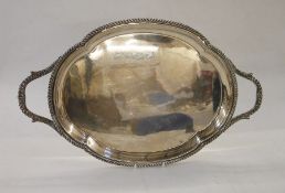 Silver tray, shaped oval with gadrooned border, gadrooned and foliate handle, 46cm wide x 28cm,