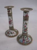 Pair of 19th century Chinese Canton porcelain table candlesticks, each with figures, birds and
