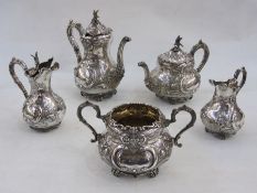 Late Victorian silver tea and coffee service of five pieces, crested and decorated with embossed C-