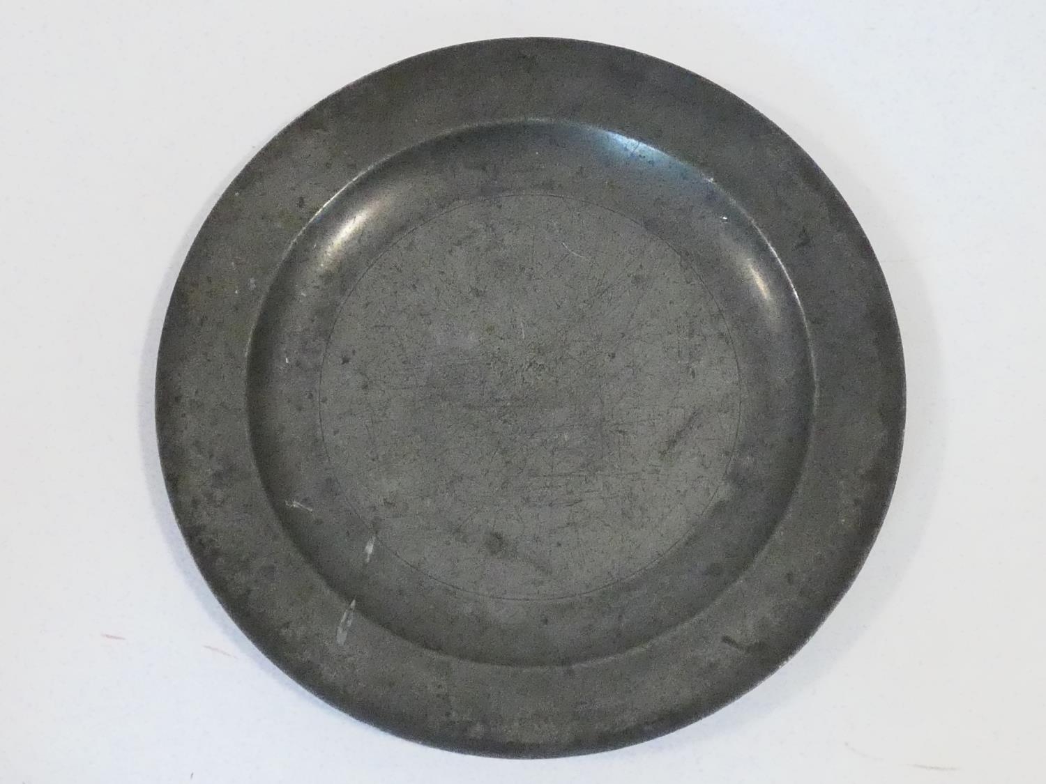 A collection of antique pewter items. Including plates, measures, pepper shaker, jug and tankards. - Image 2 of 27