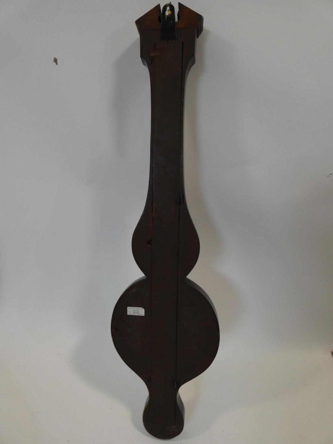 A George III mahogany banjo barometer inlaid with satinwood and olivewood oval shells and - Image 9 of 12