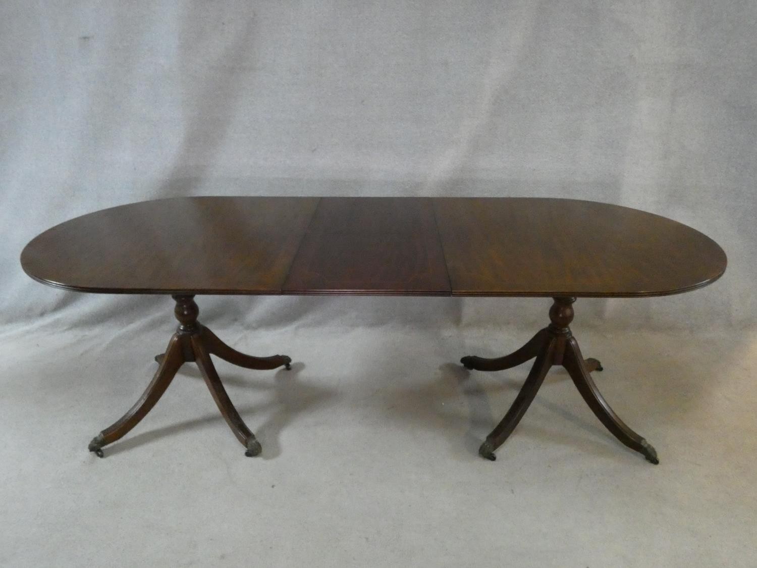 A Regency style mahogany and satinwood strung twin pillar dining table on swept quadruped supports - Image 6 of 6