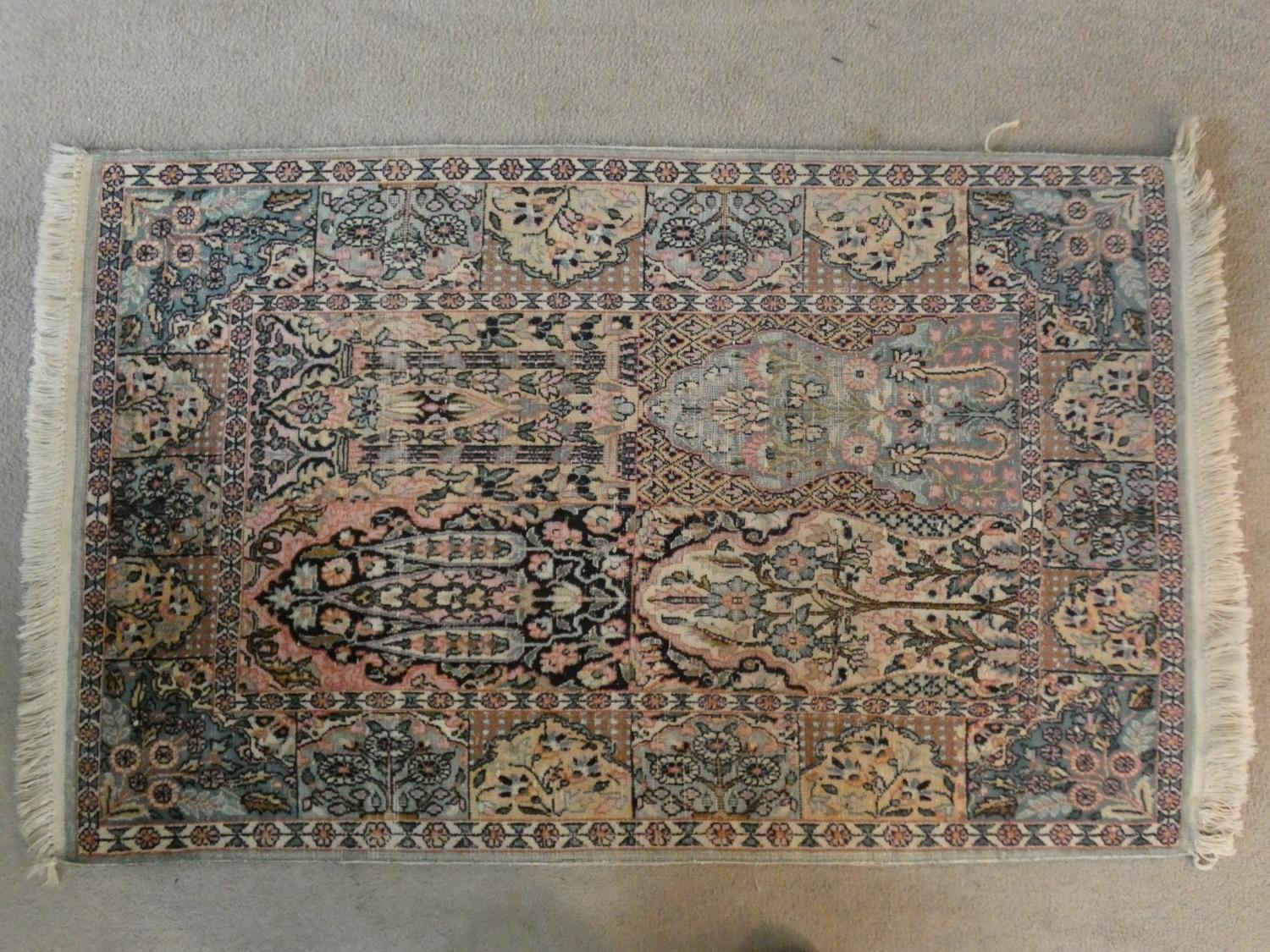 A Bakhtiar rug with central foliate panels within complementary triple borders along with a - Image 2 of 8