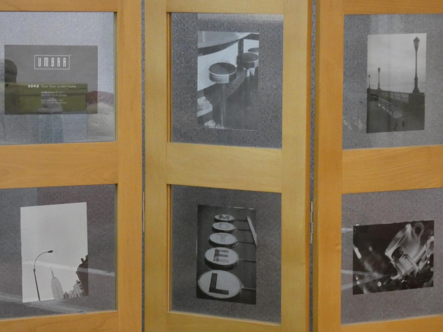 A floor standing two fold three panel screen fitted with glazed photograph window panes. H.177 L. - Image 3 of 6