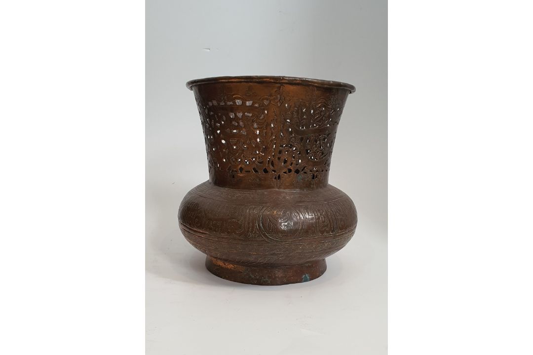 An Islamic copper pierced and repousse work lamp cover with a stylised calligraphic patterning. H. - Image 4 of 4