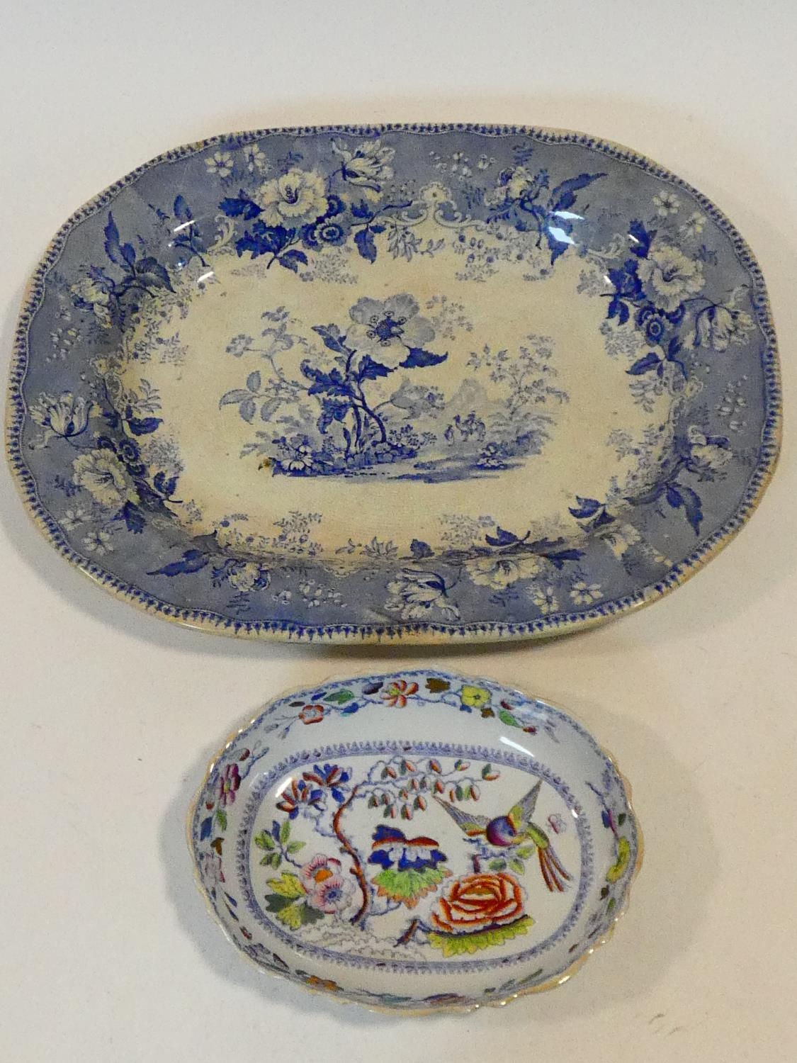 An antique ceramic blue and white transferware design meat platter with 'Botanical Beauties'