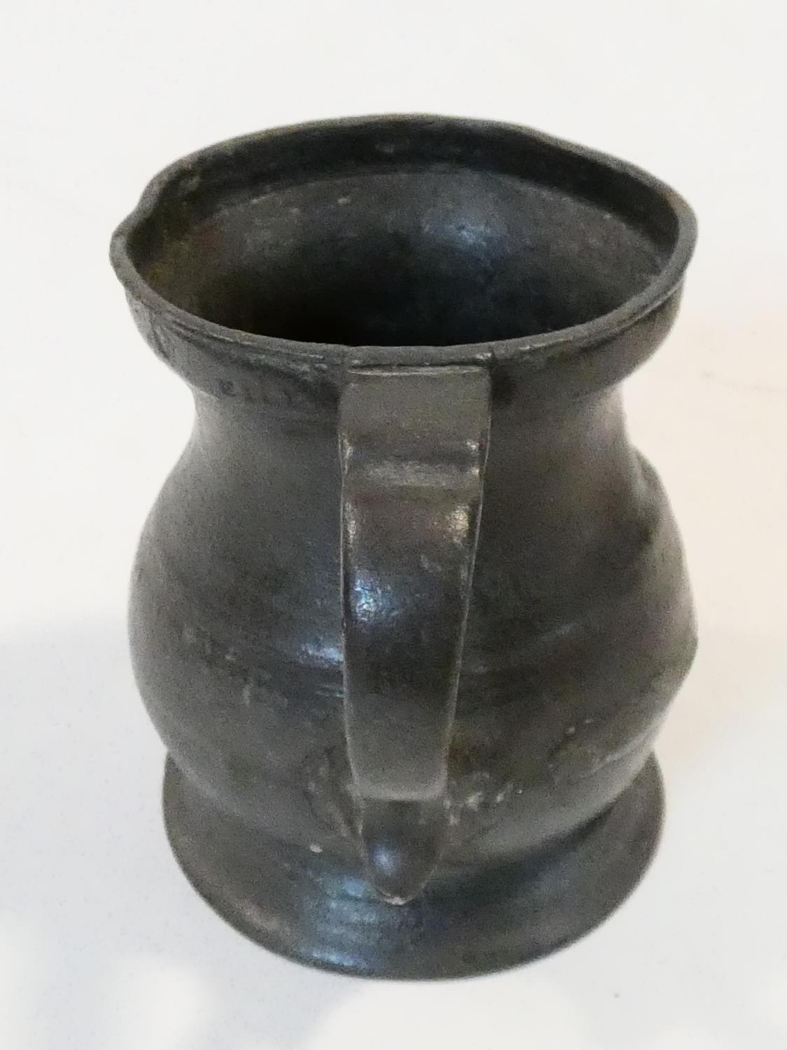 A collection of antique pewter items. Including plates, measures, pepper shaker, jug and tankards. - Image 20 of 27