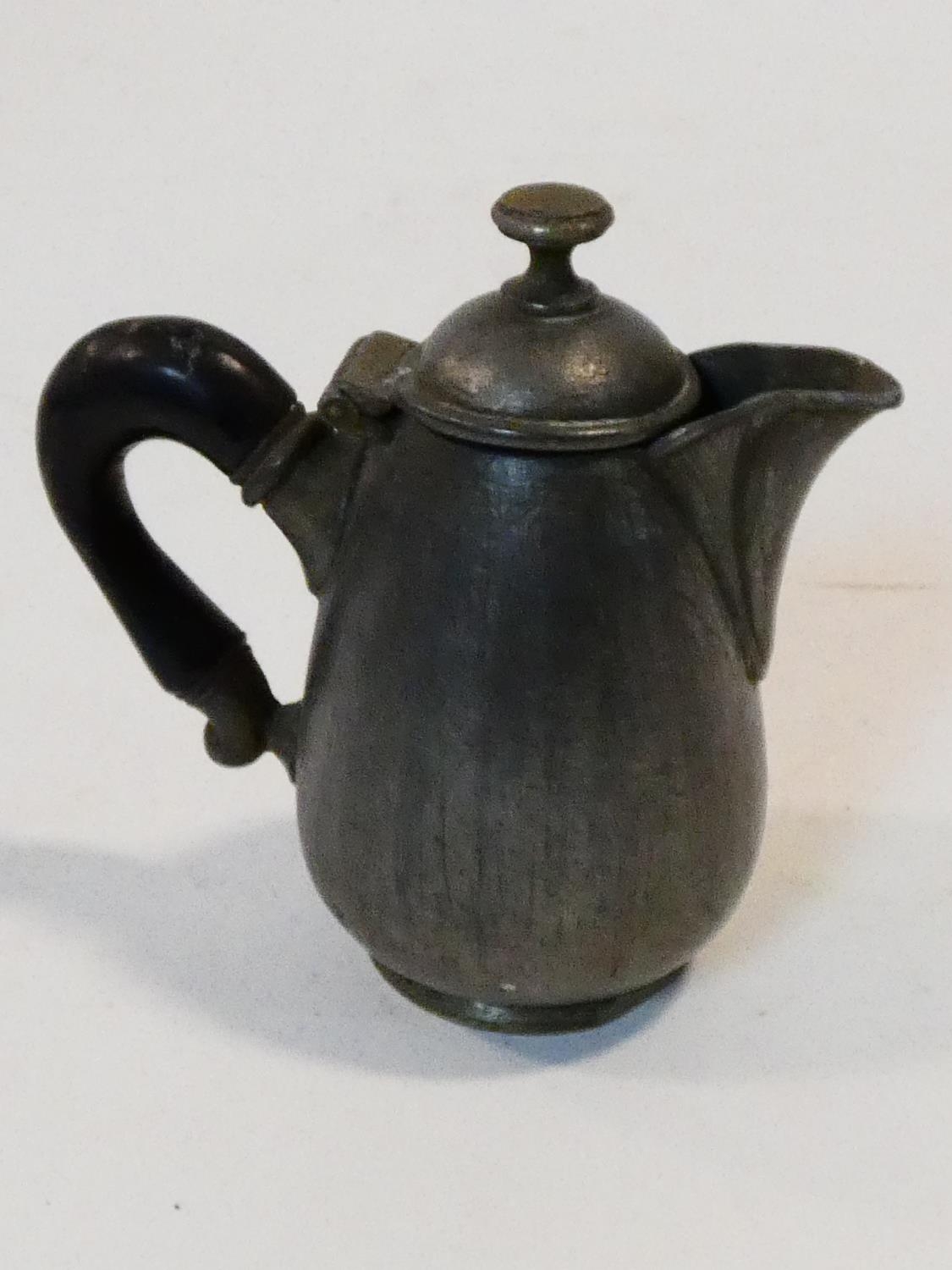 A collection of antique pewter items. Including plates, measures, pepper shaker, jug and tankards. - Image 23 of 27