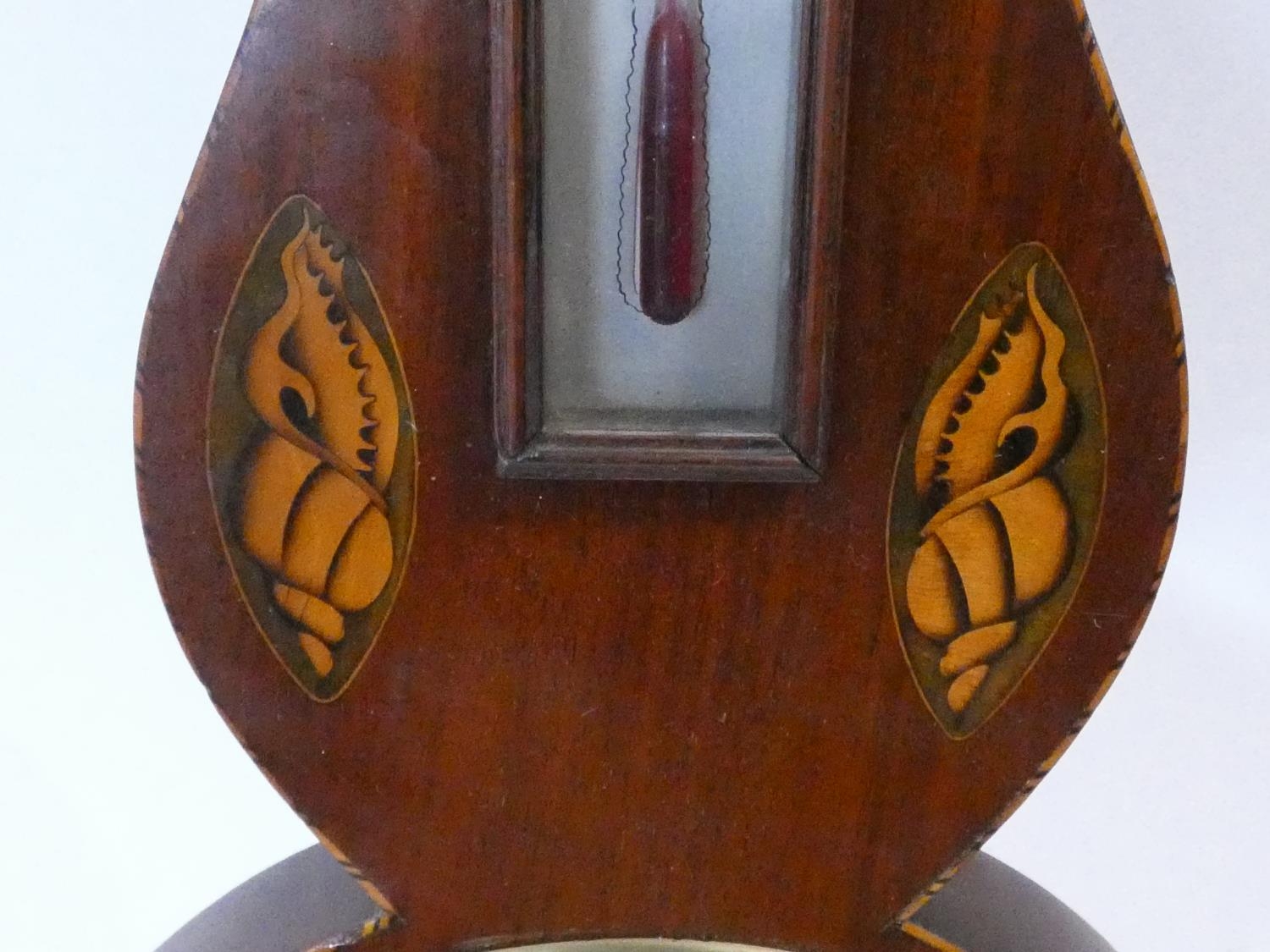A George III mahogany banjo barometer inlaid with satinwood and olivewood oval shells and - Image 8 of 12