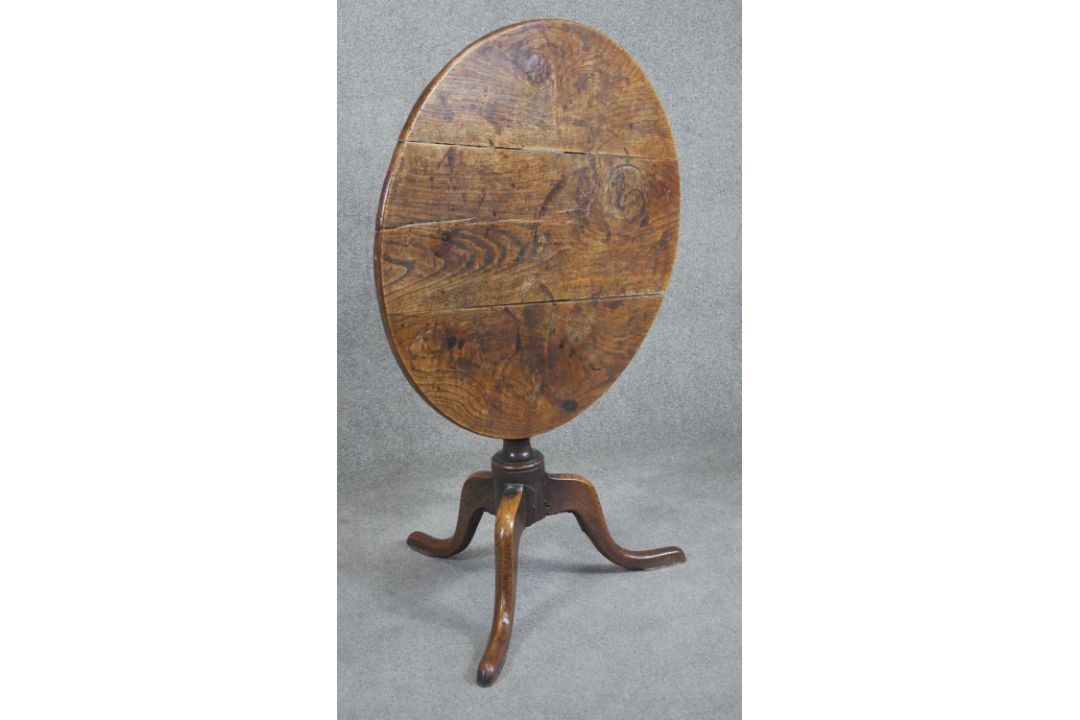 A Georgian oak tilt top table on baluster pedestal tripod supports. H.75cm (top in need of some - Image 2 of 4