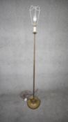 A vintage solid brass weighted base height adjustable standard lamp with silk wrapped cord. H.151