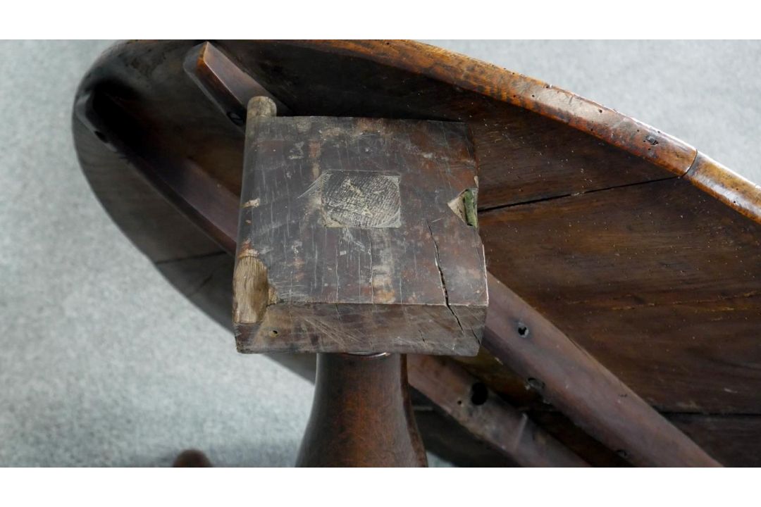 A Georgian oak tilt top table on baluster pedestal tripod supports. H.75cm (top in need of some - Image 4 of 4