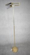 A 1970's Holtkoetter pharmacy brass floor lamp designed and made in Germany by Holtkoetter