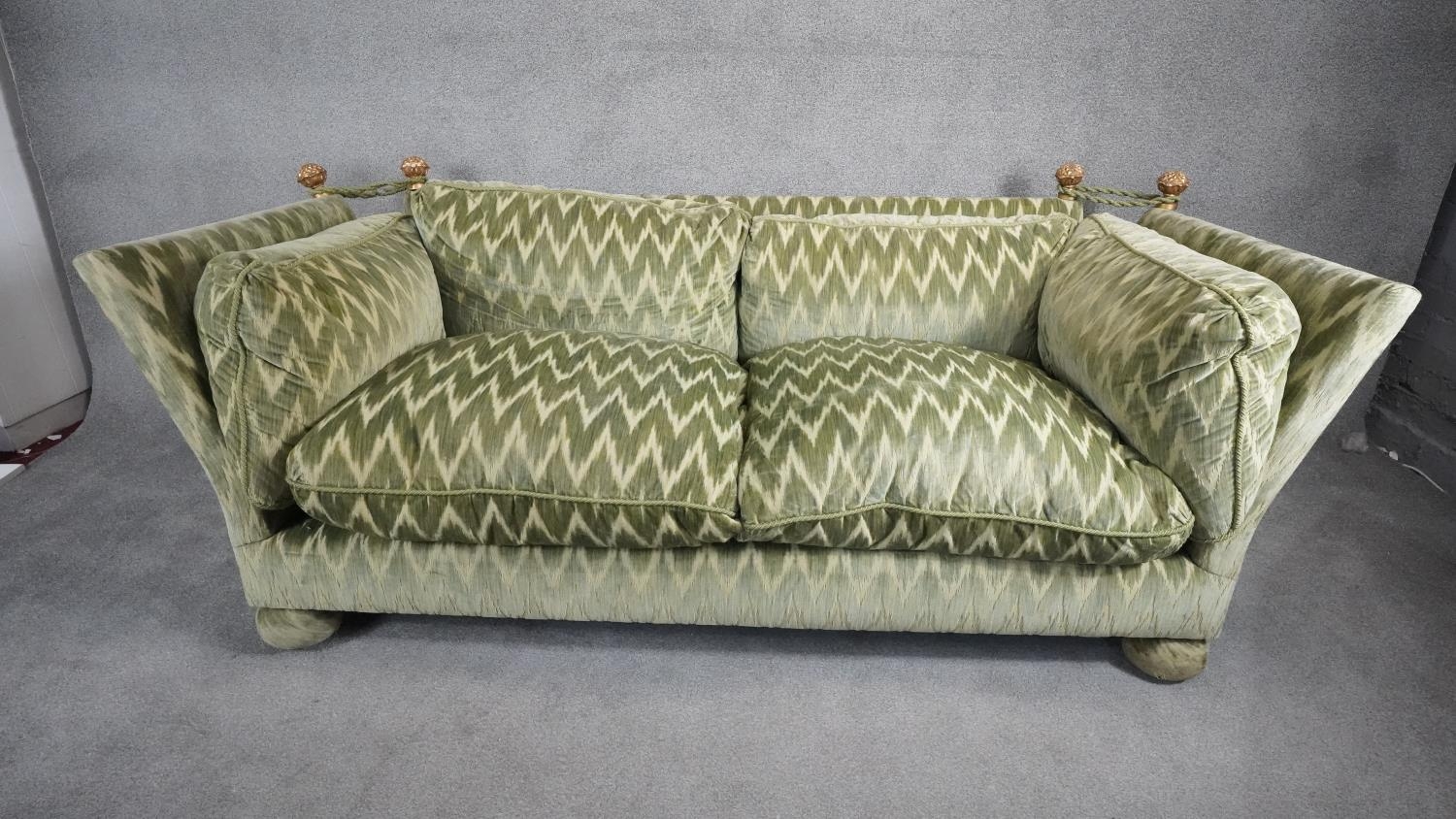A Knole sofa in cut velour upholstery the drop ends with carved giltwood finials raised on bun feet. - Image 2 of 7