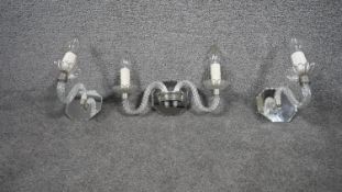 A vintage French two branch cane twist glass wall light on bevelled mirror back plate along with two