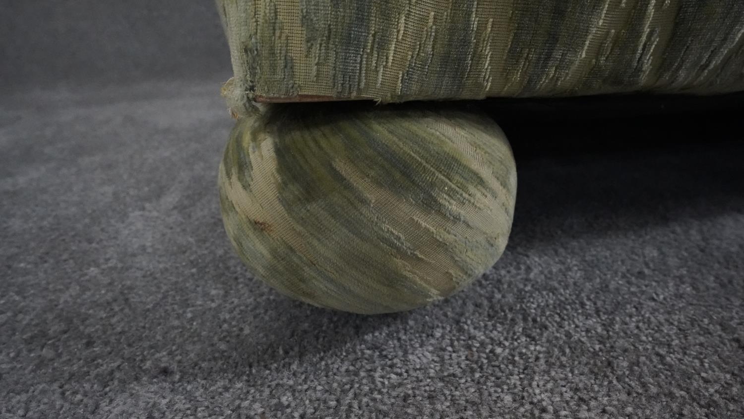 A Knole sofa in cut velour upholstery the drop ends with carved giltwood finials raised on bun feet. - Image 4 of 7