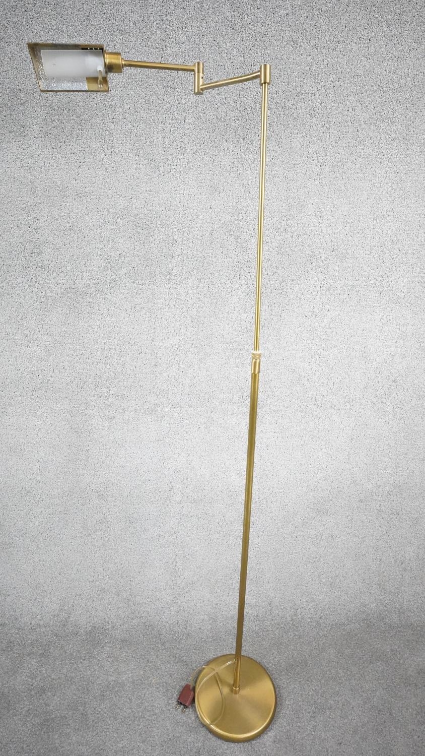 A 1970's Holtkoetter pharmacy brass floor lamp designed and made in Germany by Holtkoetter