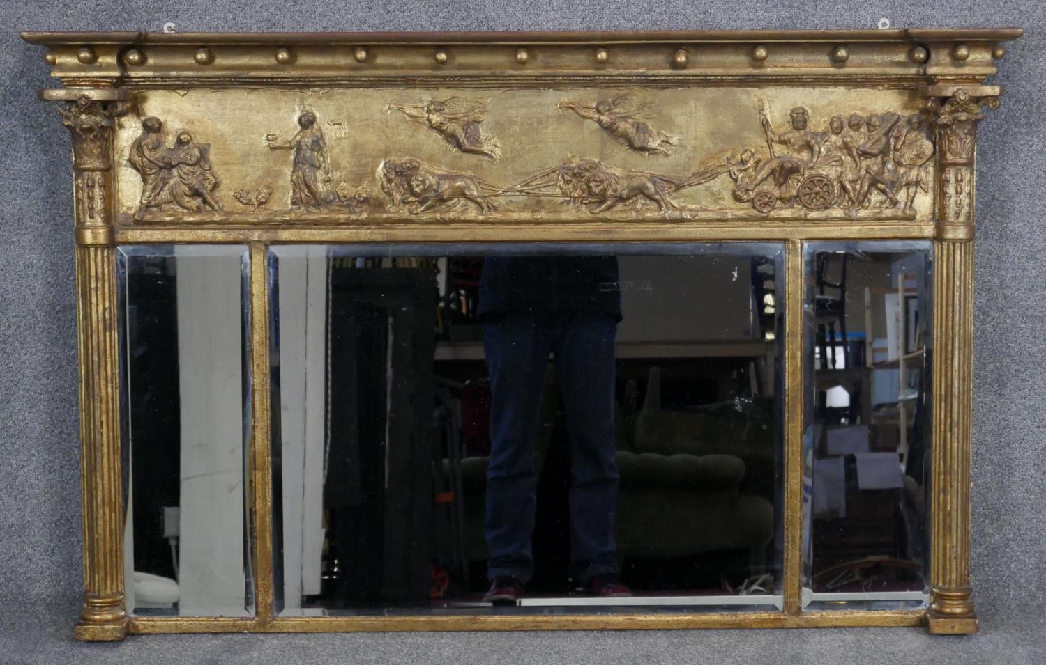 A Regency gilt overmantel mirror with ball decorated architectural cornice above frieze with
