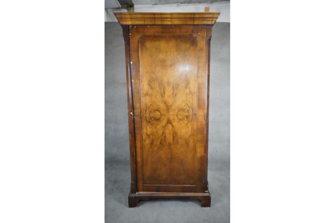 A mid century early Georgian style burr walnut wardrobe with panel door enclosing hanging space on - Image 1 of 10