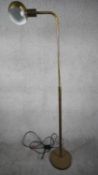 A Mid Century apothecary style solid brass height adjustable floor lamp. Domed shade has painted