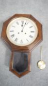 A Maritime Art Deco Mahogany veneered octagonal wall mounted clock with brass pendulum. No Key. H.53