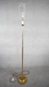 A vintage solid brass candle design height adjustable standard lamp with ridged circular base. H.167