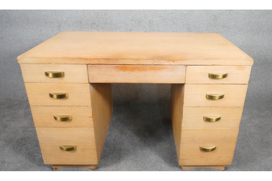 A mid century vintage limed oak pedestal desk with two banks of drawers and central frieze drawer - Image 1 of 9