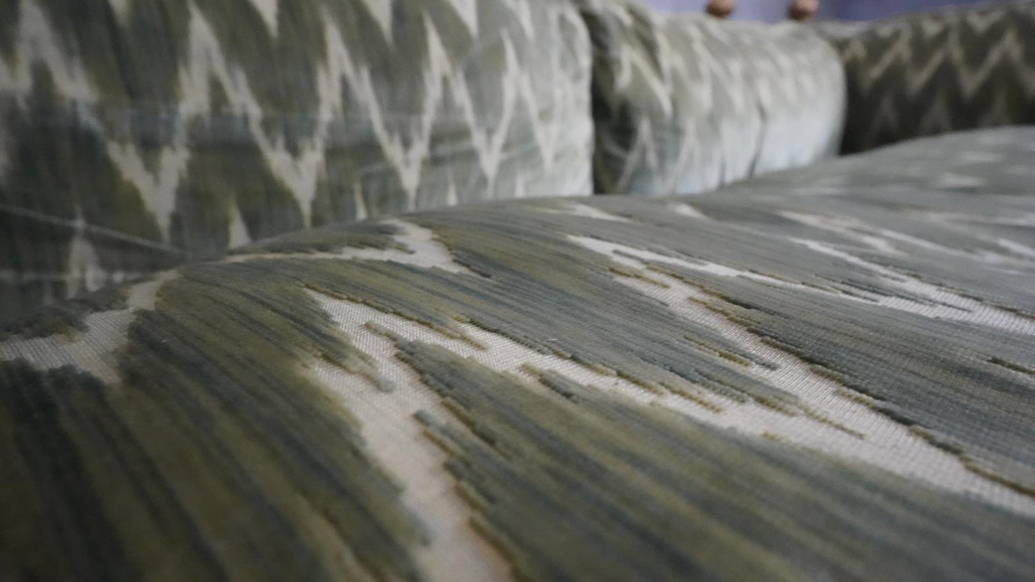 A Knole sofa in cut velour upholstery the drop ends with carved giltwood finials raised on bun feet. - Image 7 of 7