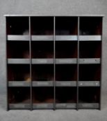 A vintage industrial style metal bank of sixteen pigeon holes. H.92 W.92 D.25cm