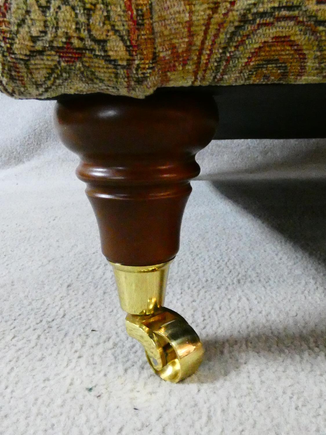 A Parker Knoll Burghley armchair in Baslow Medalli gold upholstery raised on turned tapering - Image 6 of 6