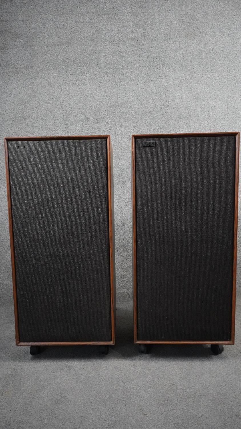 A pair of vintage Celestion Ditton 44 speakers on stands. H.84cm