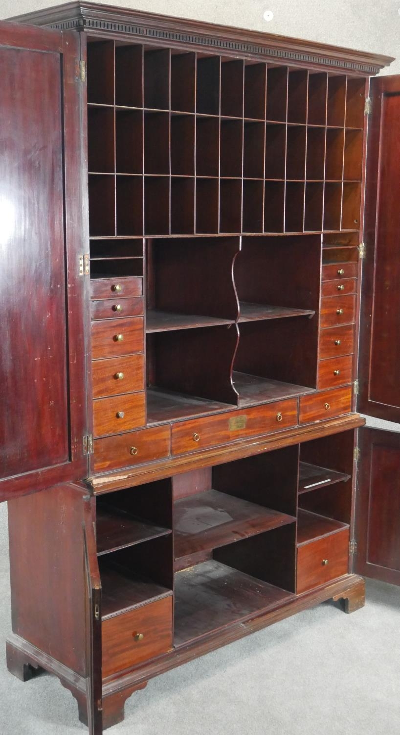 An early 19th century mahogany estate cabinet, the dentil cornice above fielded panel doors - Image 4 of 8