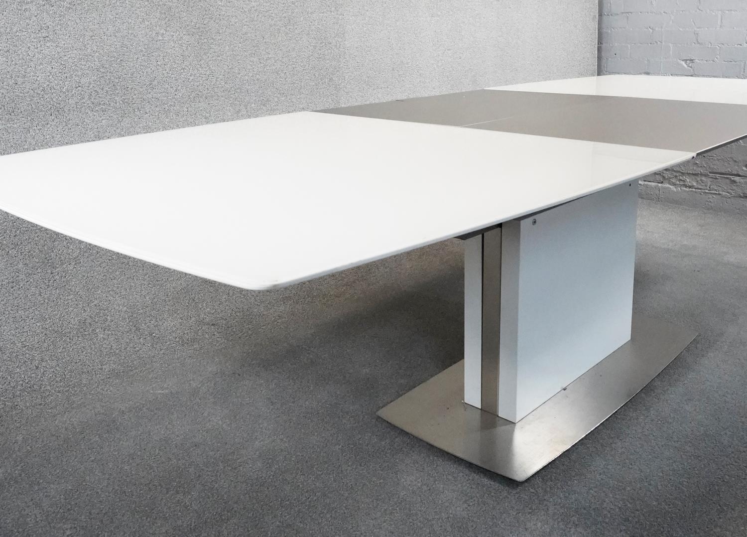 A contemporay Bo Concept extending dining room table with integral folding central leaf on - Image 3 of 6