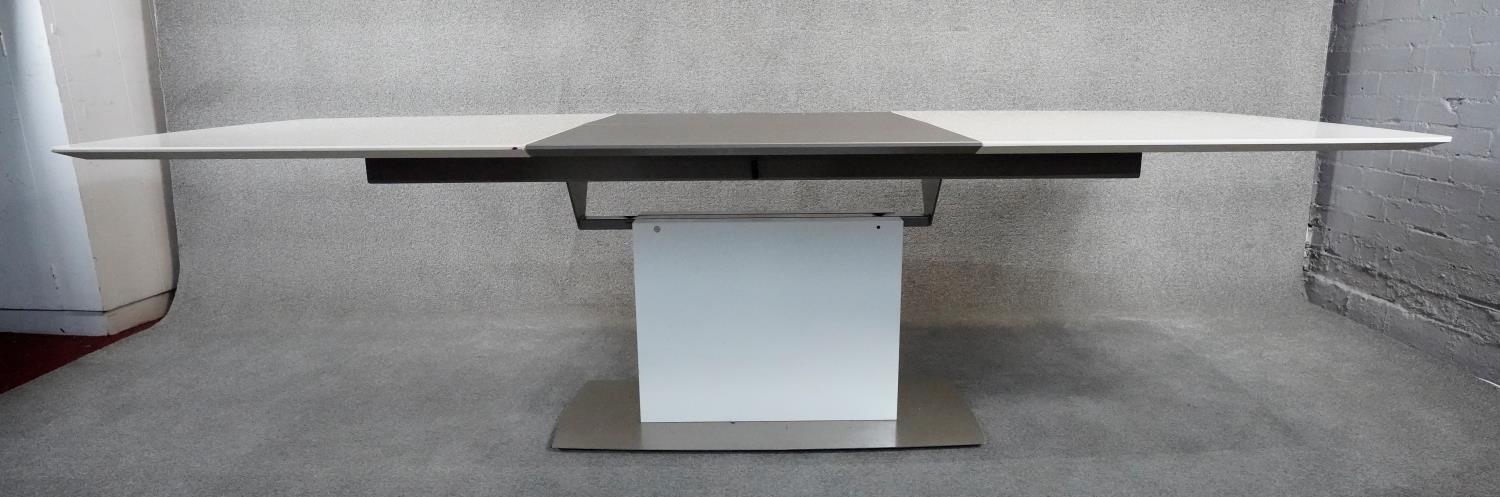 A contemporay Bo Concept extending dining room table with integral folding central leaf on - Image 4 of 6