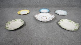 Six hand painted floral design porcelain plates. Some with handwritten numbers to the base. One