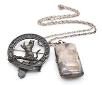 A sterling silver double sovereign case with sprung holders, mounted on a silver rope twist chain,