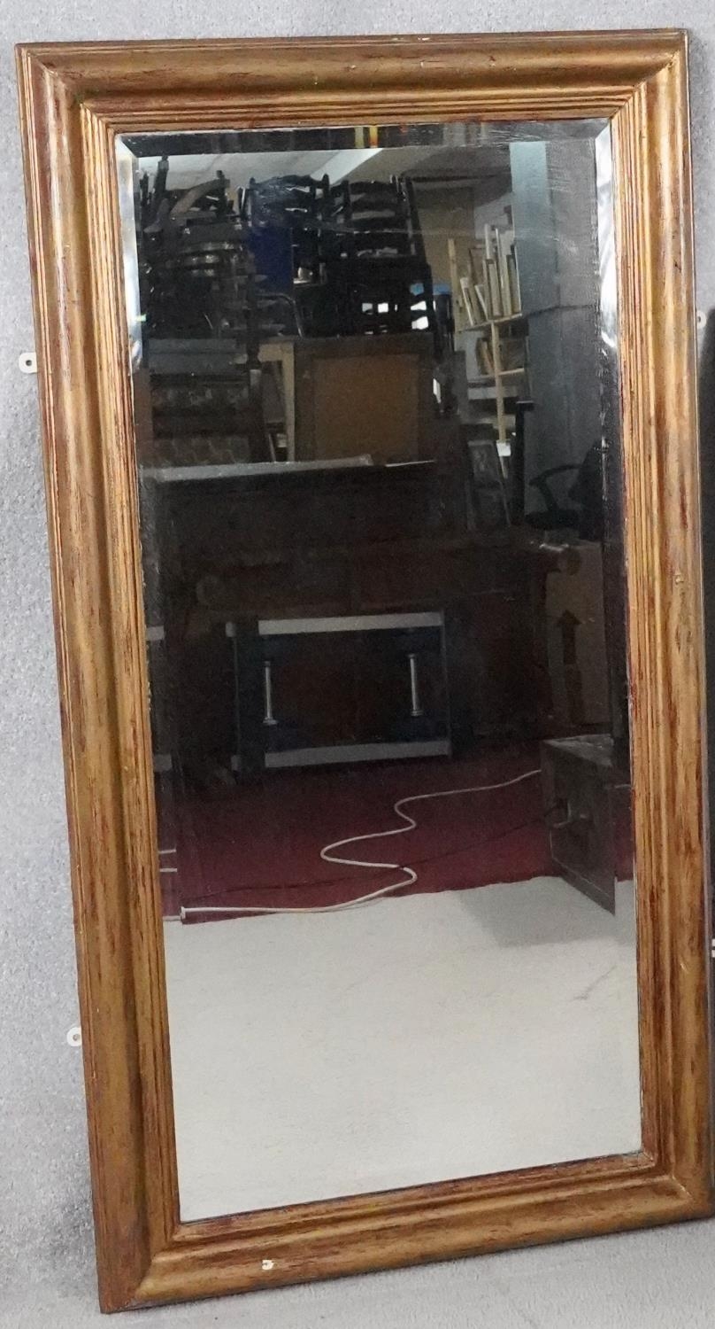 A gilt framed dressing mirror with bevelled plate. H.131 W.69cm - Image 2 of 4