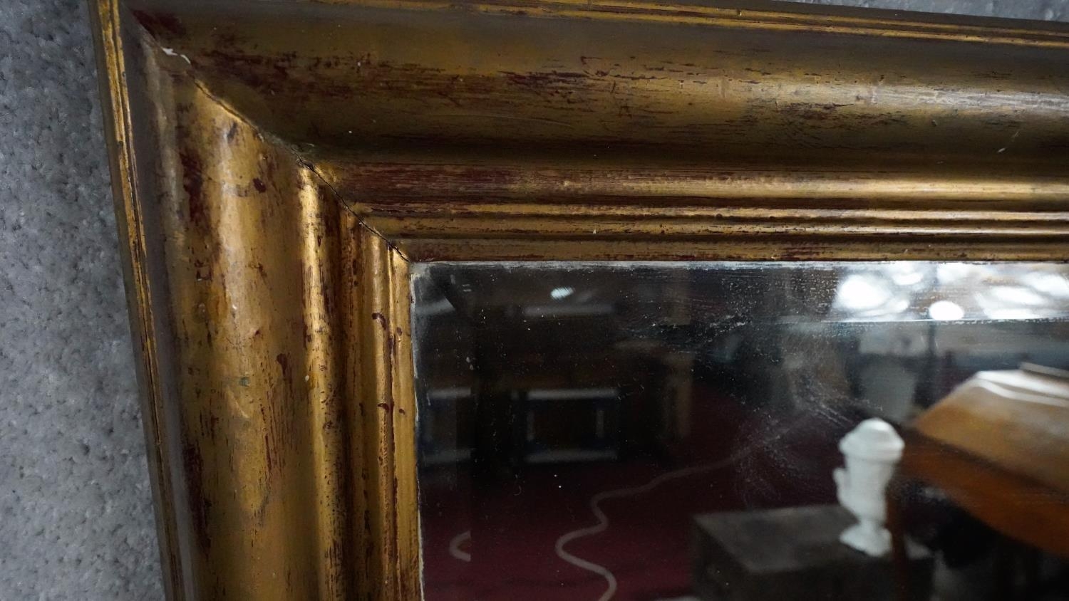 A gilt framed dressing mirror with bevelled plate. H.131 W.69cm - Image 3 of 4