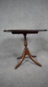A Georgian style mahogany and inlaid chess top table with tilting action. H.49 W.50 D.37cm